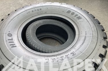 Газонная шина 26X12-16 загружена в шины погрузчика E-3/L-317.5R25; загрузка большего количества шин позволяет партнеру сэкономить средства.
